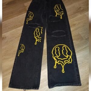 Black Jeans with Yellow Smiley Face Design